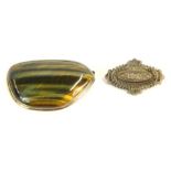 Two brooches, comprising a Victorian silver floral bar brooch, 4cm wide, 3.2g, and a Tiger's Eye bro