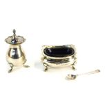 A George V and later silver cruet set, comprising pepper pot, salt cellar with blue glass liner, and