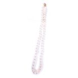 A cultured pearl single strand necklace, on knotted string with a 9ct gold ball clasp, 46cm long, 37