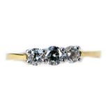 An 18ct gold three stone diamond dress ring, set with three round brilliant cut stones, each in claw