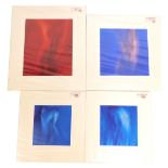 A set of four mounted prints, of The Nude Female Form, one on red ground, 50cm x 41cm, and three fur