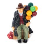 A Royal Doulton The Balloon Man figure group HN1954, 20cm high.