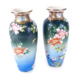 A pair of Japanese Edo period satsuma vases, each on a blue and green ground, with floral decoration