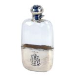 A Victorian silver and cut glass hip flask, the faceted cut glass body with a silver slip case, bear