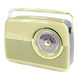 A Bush vintage radio, with a brown Bakelite case, in purple faux leather banding, 27cm high.