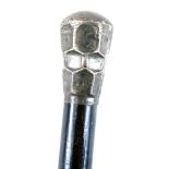 An Edward VII ebonised walking cane, with silver handle, with faceted and foliate engraved decoratio