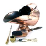 A Victorian copper helmet shaped coal scuttle, 40cm high, 44cm wide, with shovel, fire poker, brass