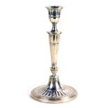 A Victorian silver candlestick, of tapered form on oval weighted base, London 1888, 8cm high, 29oz g