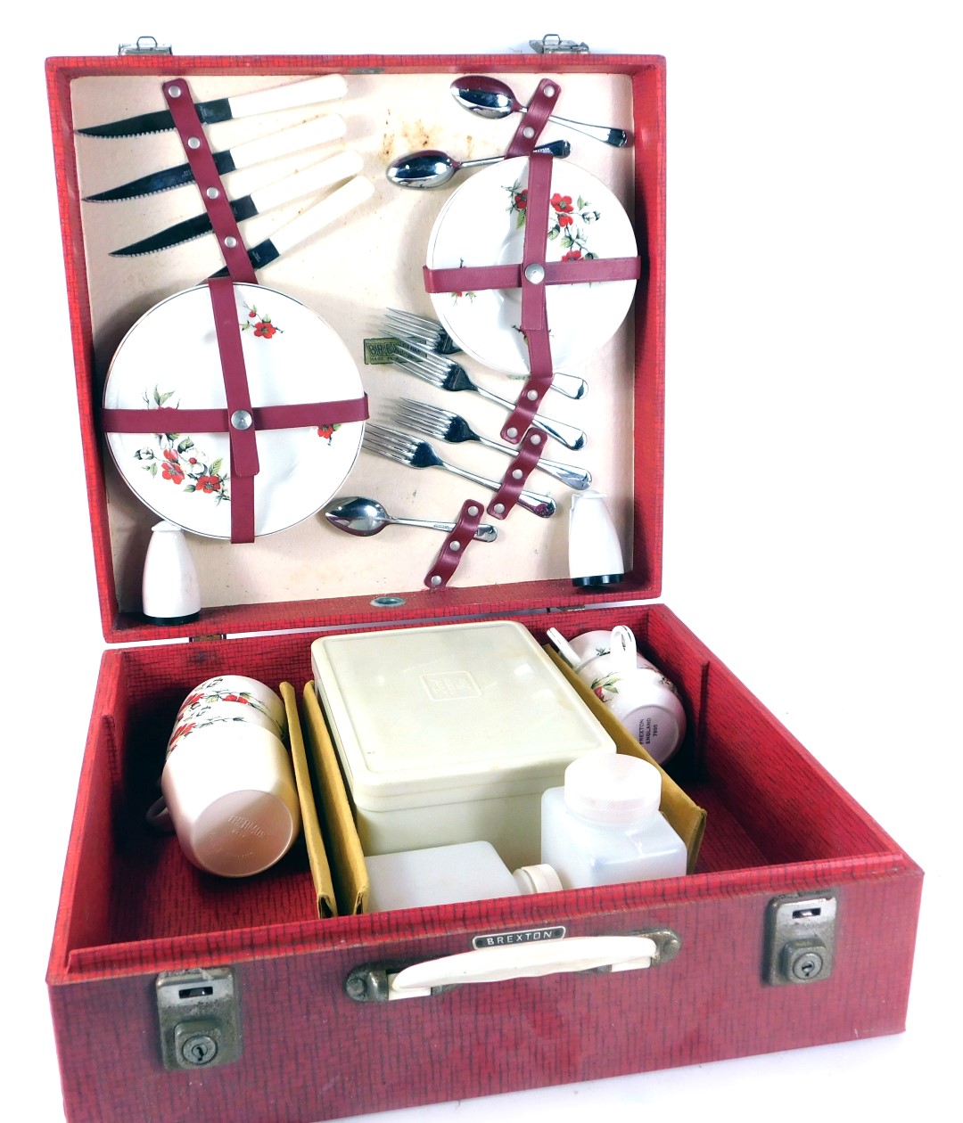 A Brexton picnic hamper, with red and white floral pattern, cased cutlery and Tupperware, in a fitte