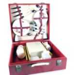 A Brexton picnic hamper, with red and white floral pattern, cased cutlery and Tupperware, in a fitte