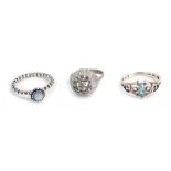 Three dress rings, comprising a Pandora silver dressing ring, size O, a CZ set cluster ring, with wh
