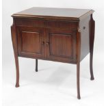 An early 20thC mahogany gramophone cabinet, the rectangular hinged top above two cupboard doors, of