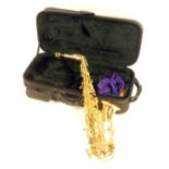 A Jupiter brass saxophone, in a black canvas fitted case.