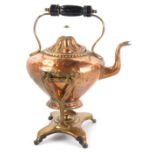 A Victorian copper kettle on stand, the fluted top with a ceramic knop and ebonised handle, 33cm hig