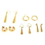 A group of 9ct gold earrings, comprising two pairs of hoops and two pairs of teardrop drop earrings,