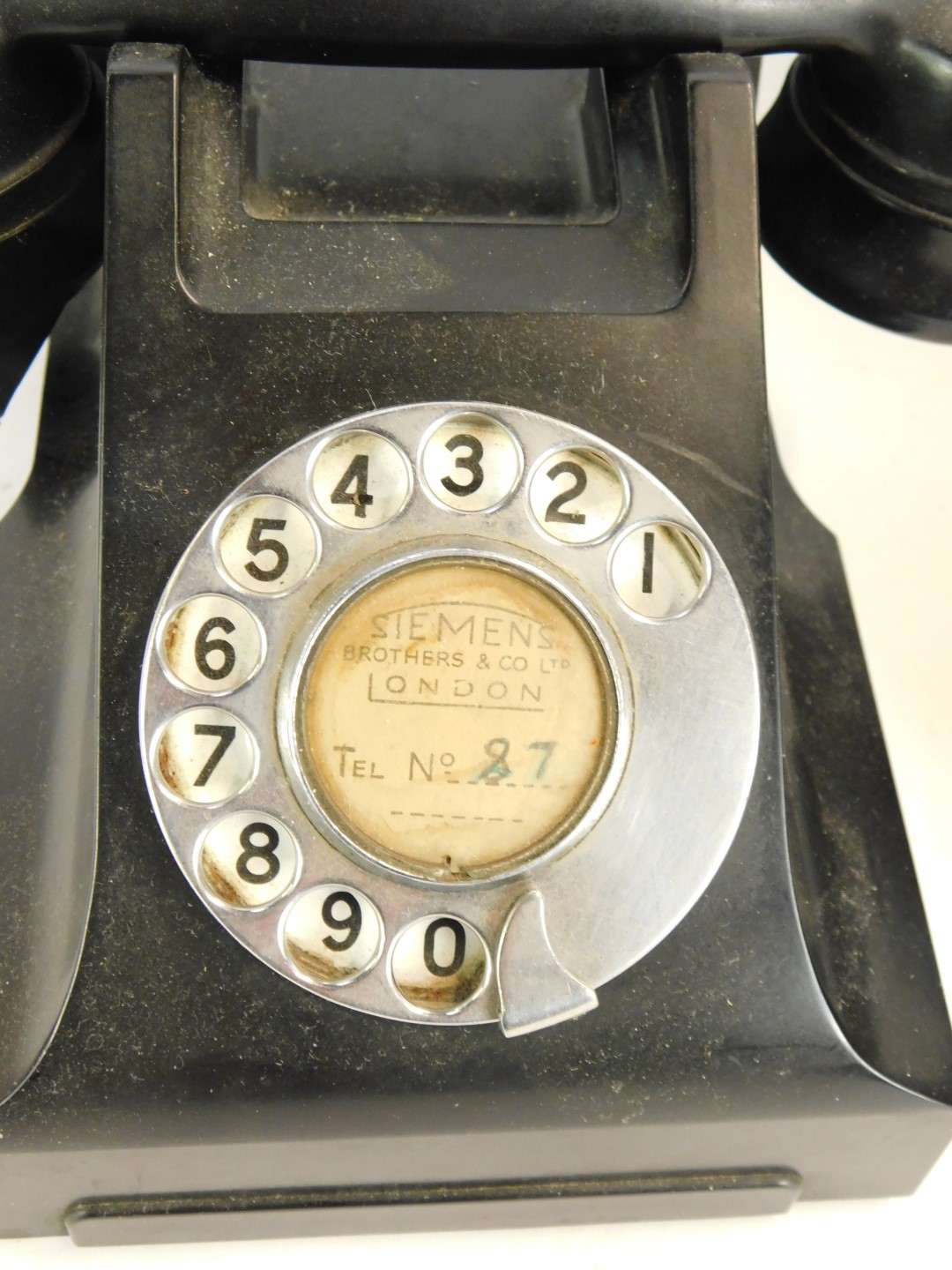 A Siemens of London black Bakelite dial telephone, number for London 87, and a brown wall mounted te - Image 2 of 3