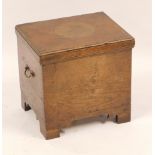 A 20thC oak coal box, with single hinged lid and a metal lined interior, with brass swing handles, 4