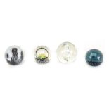 Four glass paperweights, comprising a Selkirk glass Sonar limited edition 113/350, a Caithness acrob