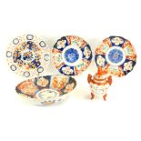 A group of Oriental ceramics, comprising two imari dishes, 21cm diameter, a pierced basket imari cab