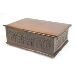 A part 18thC oak bible box, with a three planked top, above carved five sectional front, with iron l