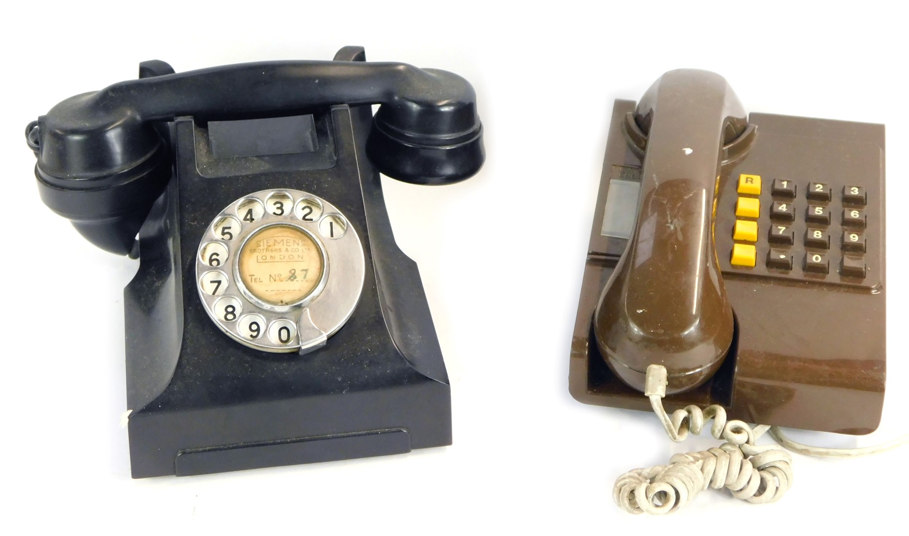 A Siemens of London black Bakelite dial telephone, number for London 87, and a brown wall mounted te