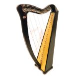 A French Camac harp, in a fitted case, 85cm long.