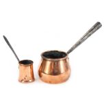 Two items of copper, comprising a brandy saucepan with an iron handle, 31cm high, and a copper measu