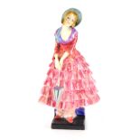 A Royal Doulton figure modelled as Priscilla, HN1340 21cm high. (AF)