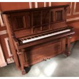 A Victorian rosewood overstrung upright piano, 134cm high, 159cm wide, 66cm deep.