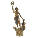 A spelter figure of a maiden, perched on a rock, representing Industry, 27cm high.