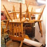 A pine circular kitchen table, and four chairs. (5)