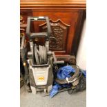 A Tachlife pressure washer, and various accessories.