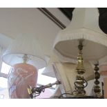 Three table lamps, comprising two brass column lamps and a pink swan ceramic lamp. (3)