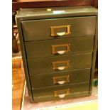 A set of five green metal filing drawers.