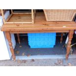 A pine kitchen table.