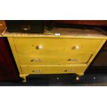 A painted pine three drawer chest, with replacement handles, lacking top, painted in yellow.