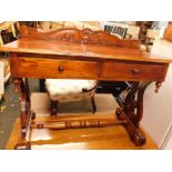 An Eastern hardwood Victorian style writing desk, with scroll carved back, above two drawers, on ly