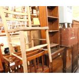 A group of furniture, comprising bookcase, magazine rack, chair, wooden trunk, Lloyd Loom cabinet, a