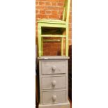 A grey painted pine three drawer chest, with wallpaper lined drawers, and a green painted chair wit