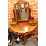 A late 19thC mahogany dressing table, with curved frontage, mirrored back and two drawers, on tripod