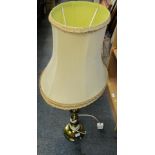A brass bulbous column table lamp.
