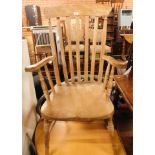 An ash and elm lath back grandfather chair, with shaped arms, 113cm high, 58cm wide.