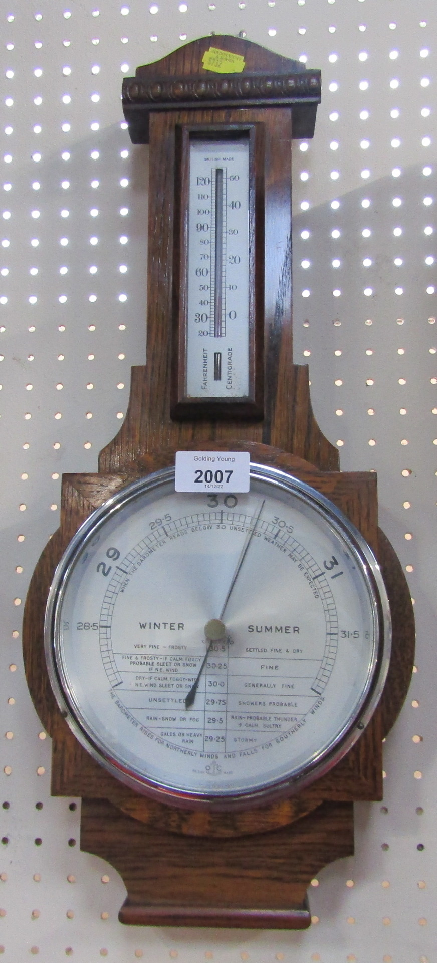 An oak cased aneroid barometer, with Fahrenheit and Centigrade dial, with Winter/Summer movement on