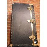A canvas bound and metal band trunk.