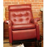 A red leatherette button back chair.