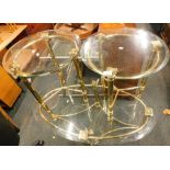 Glass and gold finish chrome coffee table, comprising two circular side tables and an oval coffee ta