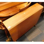 A modern drop leaf kitchen table.