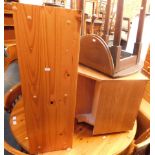 A pine circular kitchen table, a set of four chairs, a glazed TV cabinet and a bookshelf. (7)