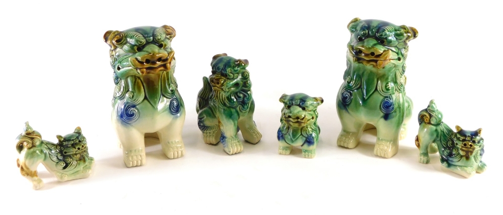 Various Chinese temple dog figures, to include a pair, 21cm high, etc. (a quantity)