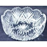 A 20thC heavy crystal bowl, with flower head rim, star cut centre and hob nail cut decoration, in a